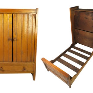 May include: A wooden cabinet with vertical paneling and two doors, featuring a single drawer with two knobs below. The piece converts into a bed frame with a slatted base, showing a natural wood finish and a functional, space-saving design.