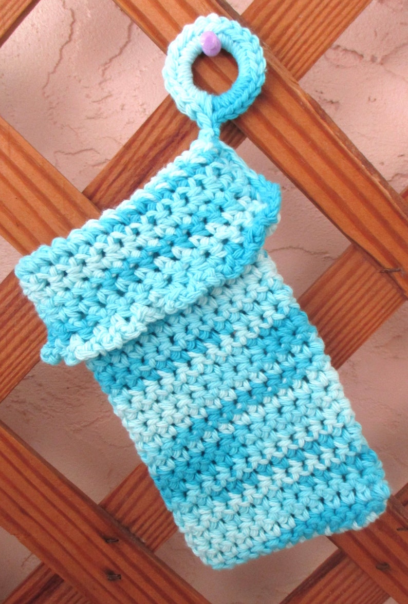 May include: A crocheted blue and light blue washcloth with a crocheted loop at the top.