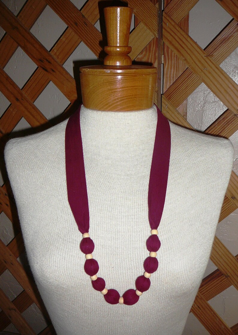 NECKLACESFabric & BeadReversibleWashableOne Size Fits AllSlips Over Your HeadSolid Colors VaryNEW BURGUNDY & CREAM