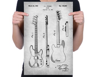 May include: Black and white line drawing of a Fender electric guitar patent. The patent drawing shows the guitar from different angles. The patent number is Des. 169,062 and the date is March 24, 1953.