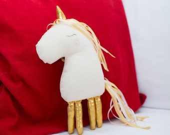 Bambola di natale oro unicorno