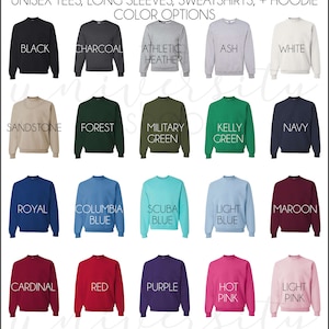 May include: A chart showing 18 different color options for unisex tees, long sleeves, sweatshirts, and hoodies. The colors include black, charcoal, athletic heather, ash, white, sandstone, forest, military green, kelly green, navy, royal, columbia blue, scuba blue, light blue, maroon, cardinal, red, purple, hot pink, and light pink.