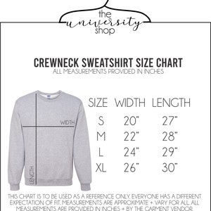 May include: A size chart for a crewneck sweatshirt. The chart shows the width and length measurements in inches for sizes S, M, L, and XL. The chart is for reference only and measurements may vary.