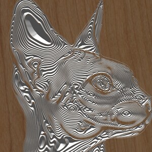 May include: A silver-colored, detailed, wooden carving of a cat's head. The carving is on a brown wooden background.