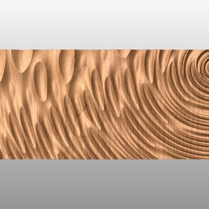 May include: A wooden wall art piece featuring a carved design of concentric circles and organic shapes. The piece is crafted from light brown wood and displays a natural wood grain.