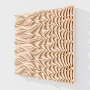 May include: A light-colored, wooden wall art piece with a wave-like pattern. The artwork is made of numerous thin, vertical wooden strips, creating a textured, three-dimensional effect. The piece is mounted on a white wall, showcasing its natural wood tones.