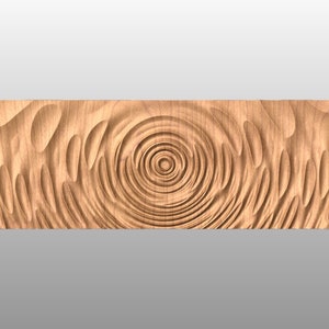 May include: A wooden wall art piece with a carved design of concentric circles and waves. The wood is a light brown color.