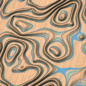 May include: Abstract wood veneer with a layered, carved design. The wood is a light brown color with blue and green lines.