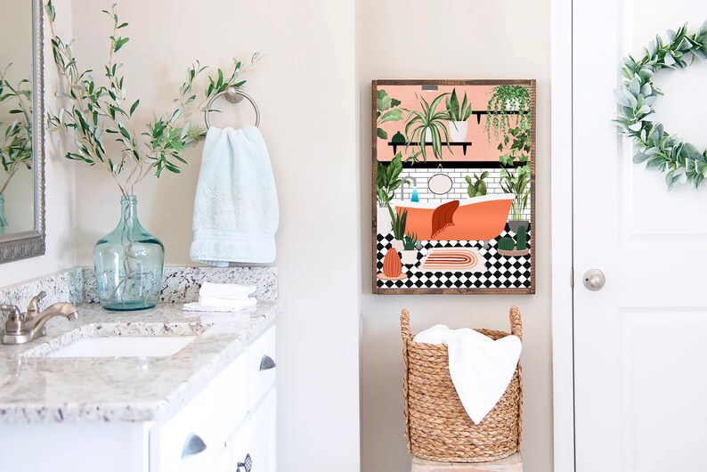 May include: A bathroom interior design print featuring a bathtub with plants and a black and white checkered floor. The print is framed in wood and hung on a white wall.
