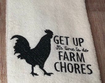 May include: White hand towel with a black embroidered rooster silhouette and the text "GET UP It's Time to do FARM CHORES". The towel is made of a soft, absorbent material, perfect for the kitchen or bathroom.