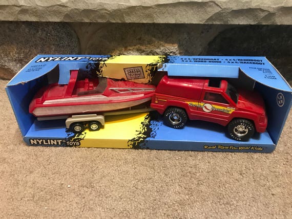 toy truck and trailer with boat