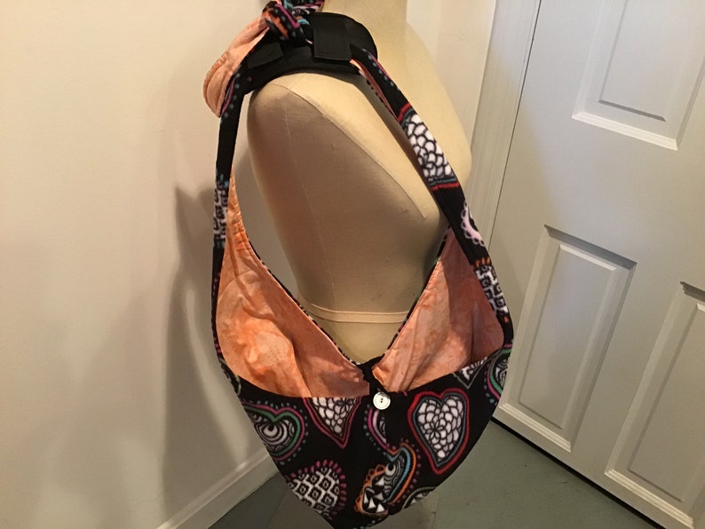 Puppy Snuggle Sack-black background with variegated hearts