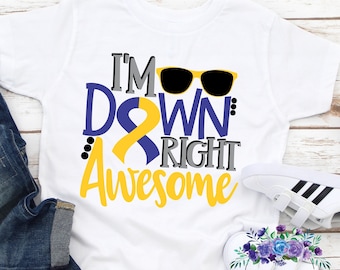 May include: White t-shirt with a yellow and blue ribbon, sunglasses, and the text "I'm Down Right Awesome".