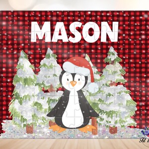May include: A rectangular jigsaw puzzle featuring a red and black buffalo plaid background with the name MASON in white capital letters. The design includes a cartoon penguin wearing a red Santa hat, surrounded by snow-covered evergreen trees.