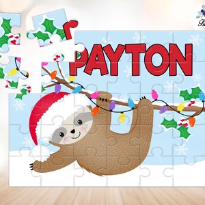 May include: A personalized puzzle featuring a cartoon sloth wearing a Santa hat, hanging from a branch with Christmas lights. The name "PAYTON" is displayed in red letters on a light blue background with snowflakes and holly.