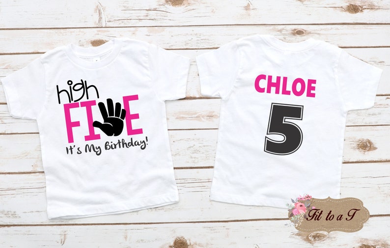 May include: White t-shirt with pink text that says "high FIVE" with a black handprint and "It's My Birthday!"  The back of the shirt has the name "CHLOE" in pink text and the number "5" in black.