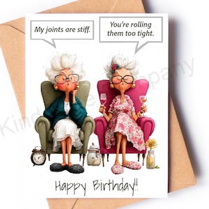 May include: A greeting card featuring two elderly characters in armchairs with speech bubbles that read My joints are stiff and You're rolling them too tight. The card includes the text Happy Birthday and sits on a brown envelope.