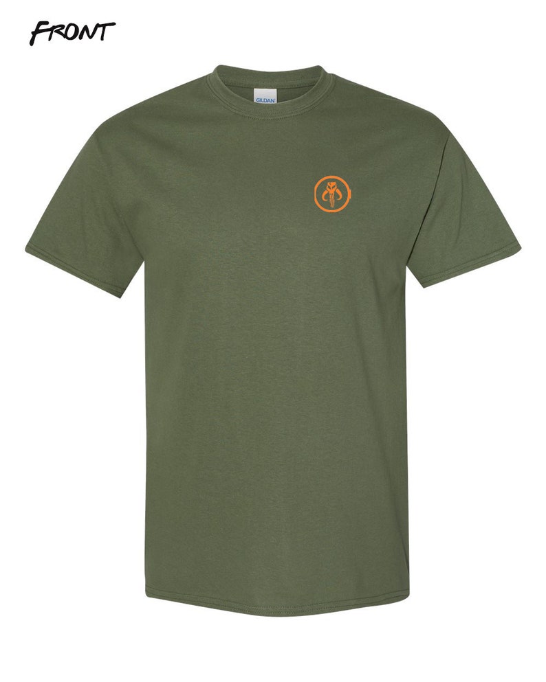 May include: A green t-shirt with an orange Mandalorian symbol on the front.