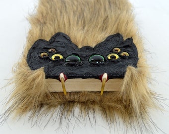 Furry Creature with Fangs Blank Book