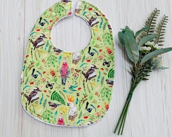 Patterned Australian bib with birds and flora