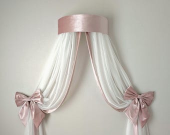 Elegant crown canopy with bows.