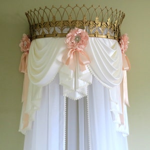 Gold crown with swag valance and curtains.