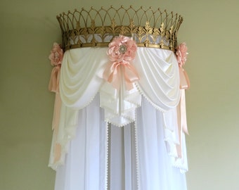Gold crown with swag valance and curtains.