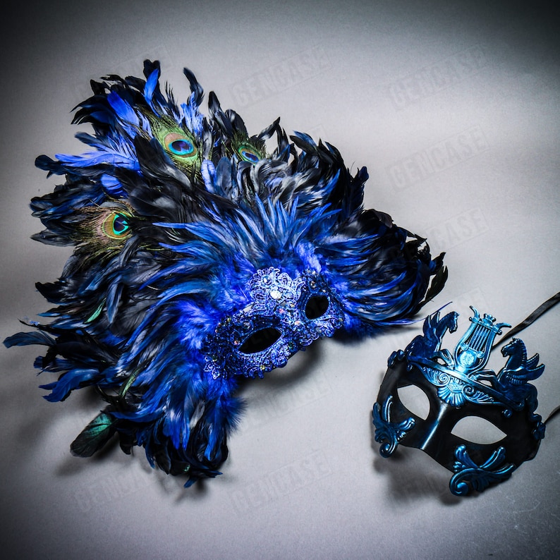May include: A pair of masquerade masks. One mask is blue with peacock feathers and rhinestones. The other mask is blue with a lyre design.