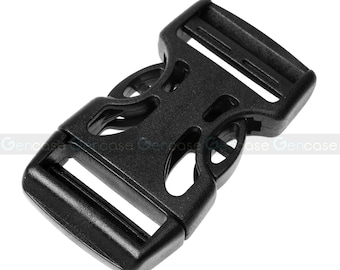 May include: Black plastic buckle with a unique design. The buckle has a rectangular shape with a hole on each side for attaching straps or webbing.