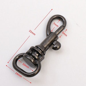 May include: A silver-toned metal swivel snap hook with a 14 mm opening, 10 mm width, 7 mm height, and 5 mm thickness. The hook is 32 mm long.