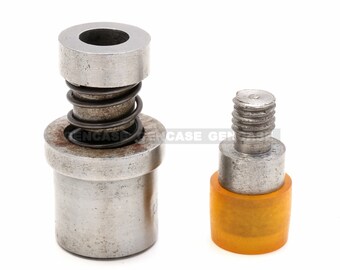 May include: Two metal tools for setting eyelets. The larger tool has a spring and a metal base. The smaller tool has a yellow plastic base.