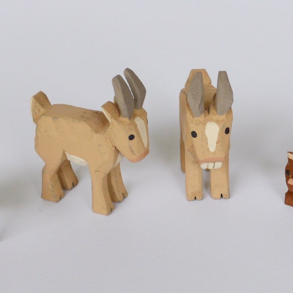 Hand Carved wooden Goats, Kiwi's and Martin