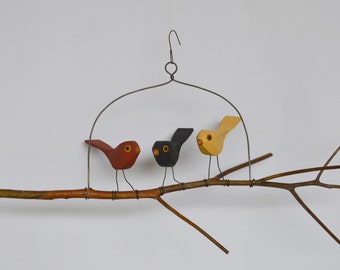 Three hand carved folk bird branch swing