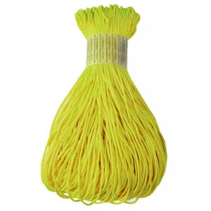 May include: A bundle of bright yellow cotton cord, tightly wrapped and ready for use. The cord is a vibrant, solid color, and a paper label is wrapped around the top. This cord is suitable for various crafting and DIY projects.
