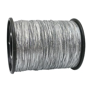 May include: A spool of silver and black metallic thread. The thread is tightly wound around a black plastic spool. The metallic thread has a reflective quality, creating a shimmering effect. Ideal for crafting, embroidery, or decorative projects.