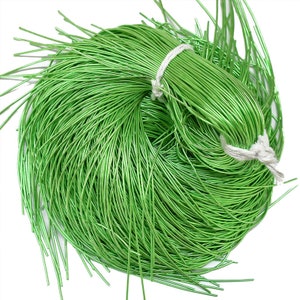 May include: A spool of bright green metallic wire, perfect for crafting and jewelry making.