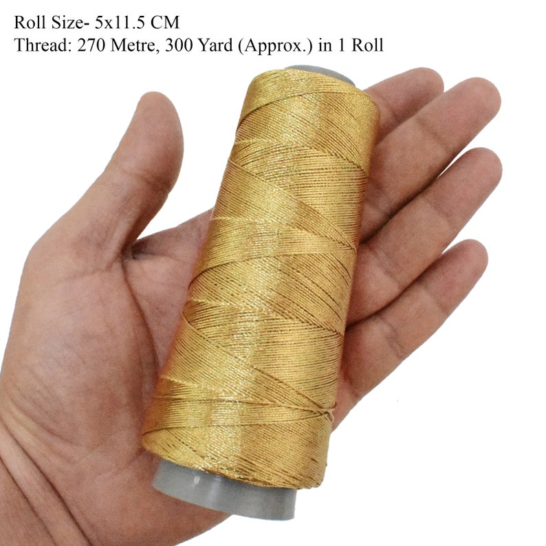 May include: A gold metallic thread spool, 5 inches by 11.5 inches, with 270 meters or 300 yards of thread.