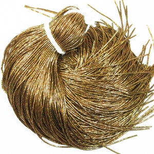 May include: A bundle of gold metallic cord, perfect for crafting jewelry or adding a touch of sparkle to your projects.
