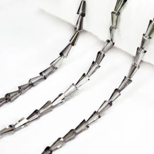 4x7MM Cone Faceted Crystal Transparent Beads in Greyish Brown Color-EMBFCB5404-1 Strand: 65 Beads Approx.