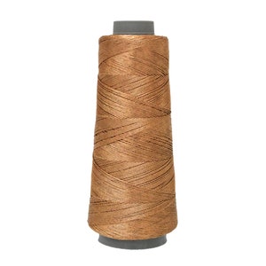 May include: A spool of brown thread wound on a grey plastic bobbin.