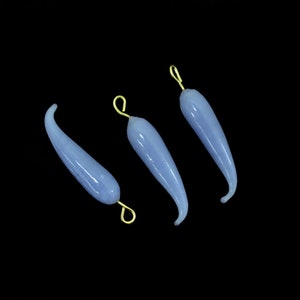 May include: Three light blue glass teardrop-shaped pendants with gold-colored metal loops. The pendants are approximately 2 inches long.