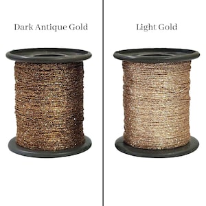 May include: Two spools of metallic gold thread, one dark antique gold and one light gold.