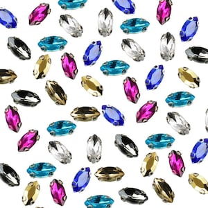 Pode incluir: Conjunto de strass em forma de marquise de várias cores, incluindo rosa, azul, dourado e preto.