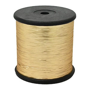 May include: A spool of gold-coloured wire. The wire is tightly wound around a black plastic spool. The spool has a flat top and bottom, with a hole in the centre of the top. The wire appears to be made of a shiny, metallic material.