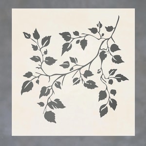 May include: A black silhouette of a leafy branch with multiple leaves and twigs. The branch is stylized and has a delicate, flowing design.