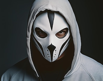 May include: A person wearing a white hooded sweatshirt with a black and white skull mask.
