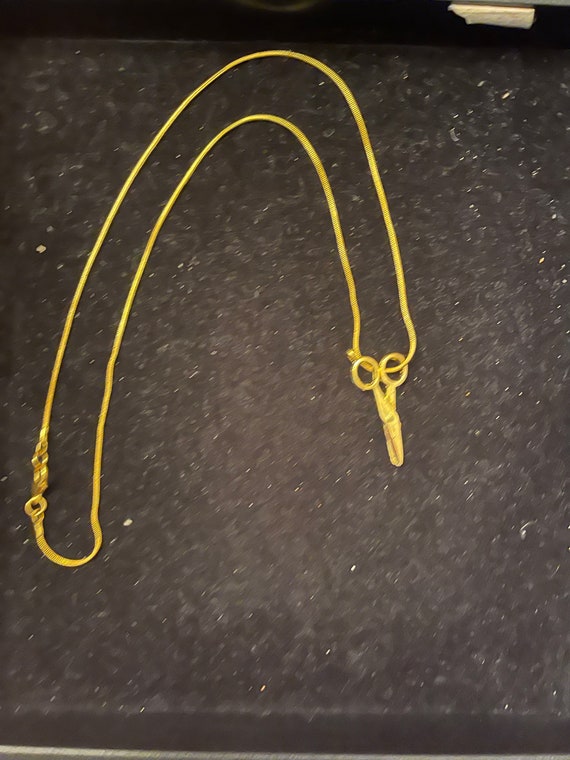 Scissors on a gold  tone 18" chain  Gold Tone tone