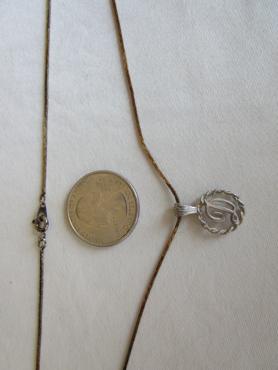 Initial D in cursive in a etched bezel on a 18' i… - image 2