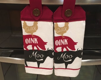 homemade hanging towels set of 2, with Cluck, Oink, Moo on the towel with a Maroon fabric top, and brown button
