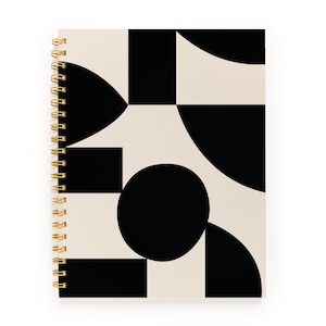 May include: Spiral-bound notebook with a geometric design. The cover features a pattern of black shapes on a cream background. The spiral binding is gold-coloured.
